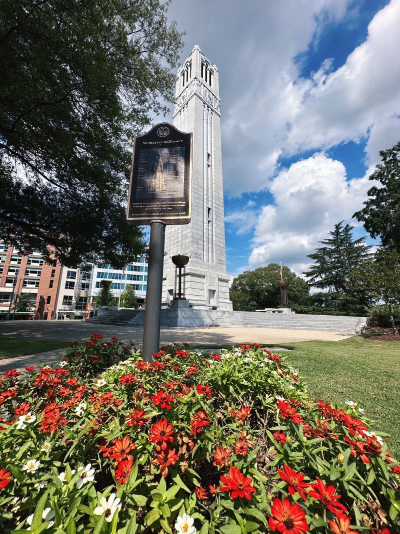 NC State Memorial Belltower surrounded by flowers